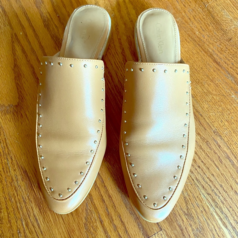 Calvin Klein studded mules.